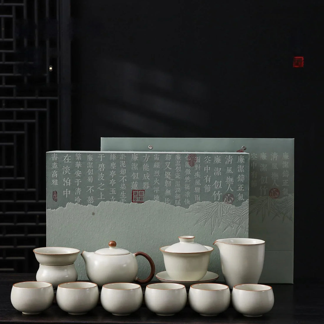 Ceramic gongfu tea set with teapot and cups for comparing ceramic and Yixing teaware.