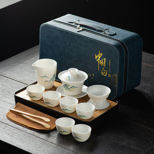 Creamy white porcelain gongfu tea set with serving tray and leather case.