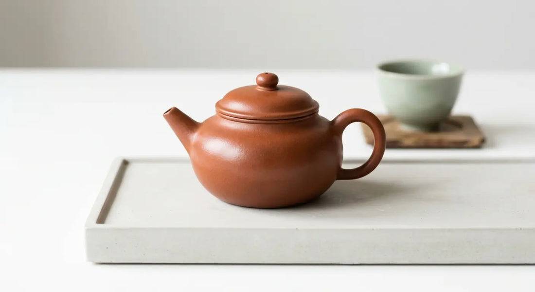 Seasoned Yixing clay teapot with natural patina finish.