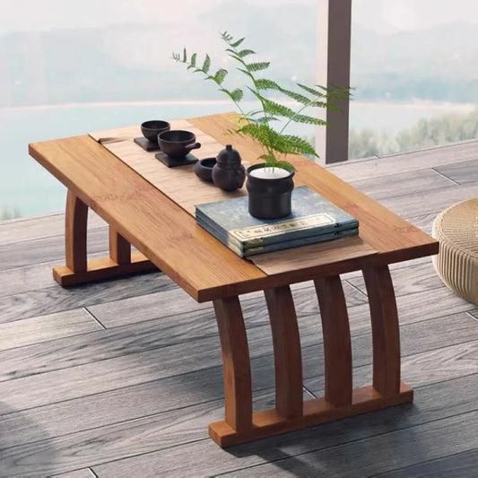 Bamboo arched low tea table styled for a compact gongfu tea setup.